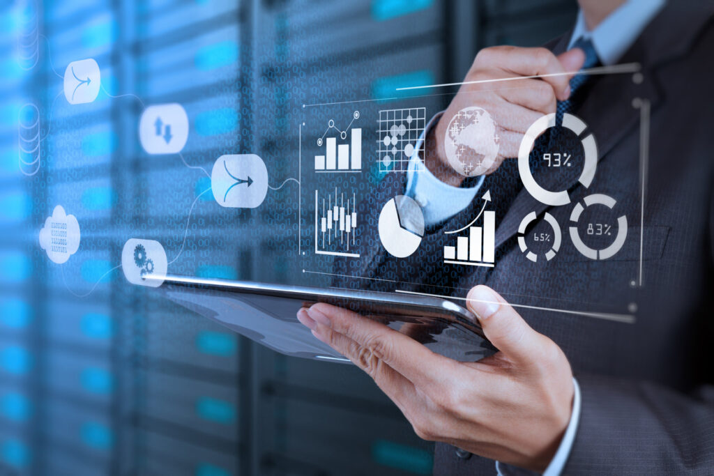 Data Management System (DMS) with Business Analytics concept. businessman working with provide information for Key Performance Indicators (KPI) and marketing analysis onn virtual computer